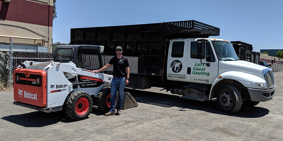 Left Coast Hauling junk removal truck and Bobcat excavator