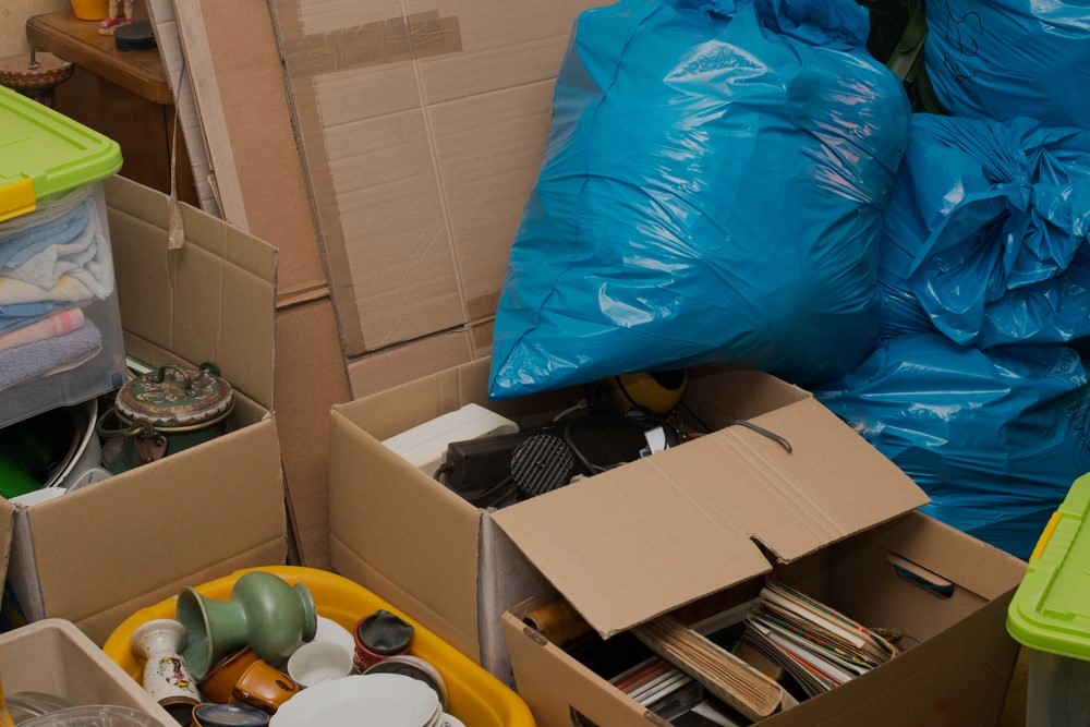 Boxes and bags in need of hoarder junk removal services in California