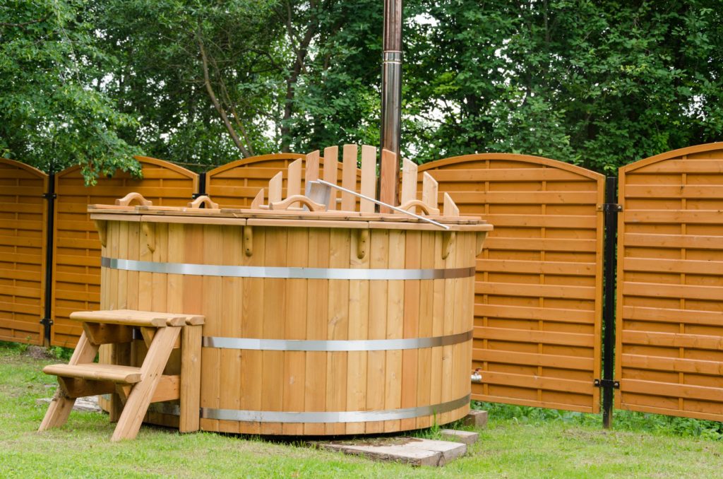 Wooden hot tub to be removed by junk removal professionals.