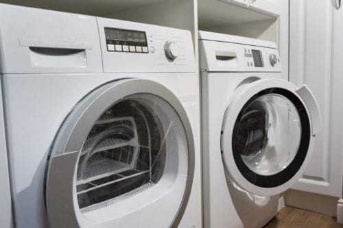 Washer and dryer in need of removal by junk removal experts.