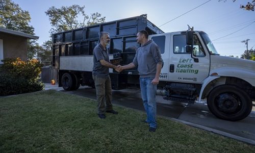 a left coast hauling pro assisting a customer with pricing