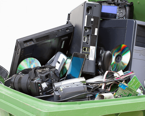 Garbage bin filled with old electronics