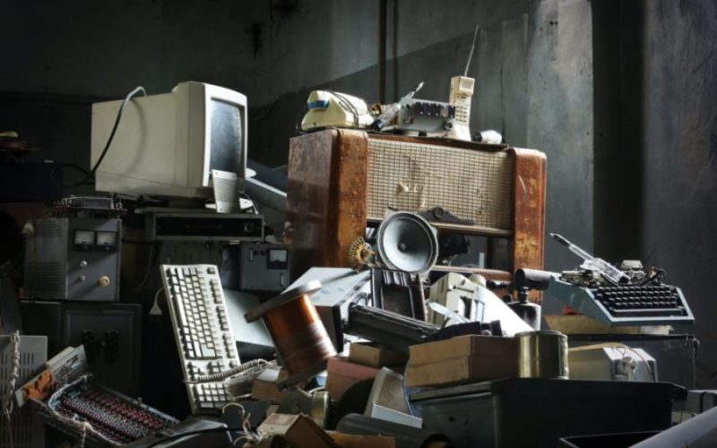 Old electronics in need of electronics removal services during an apartment cleanout