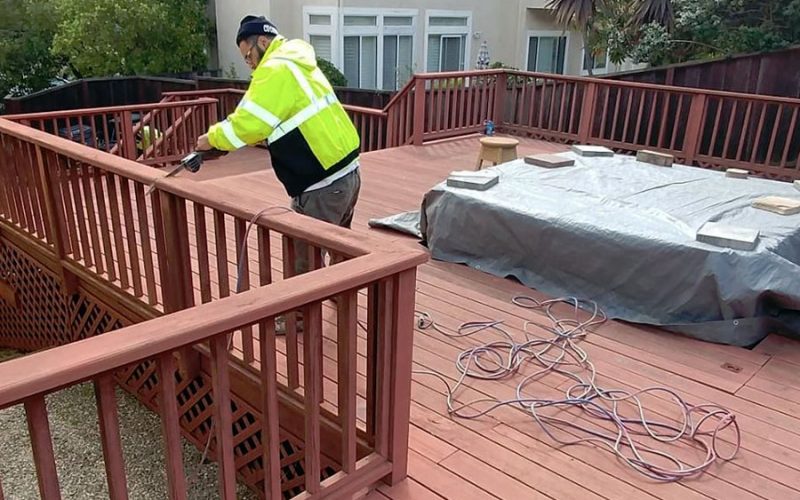 Junk removal expert on a deck